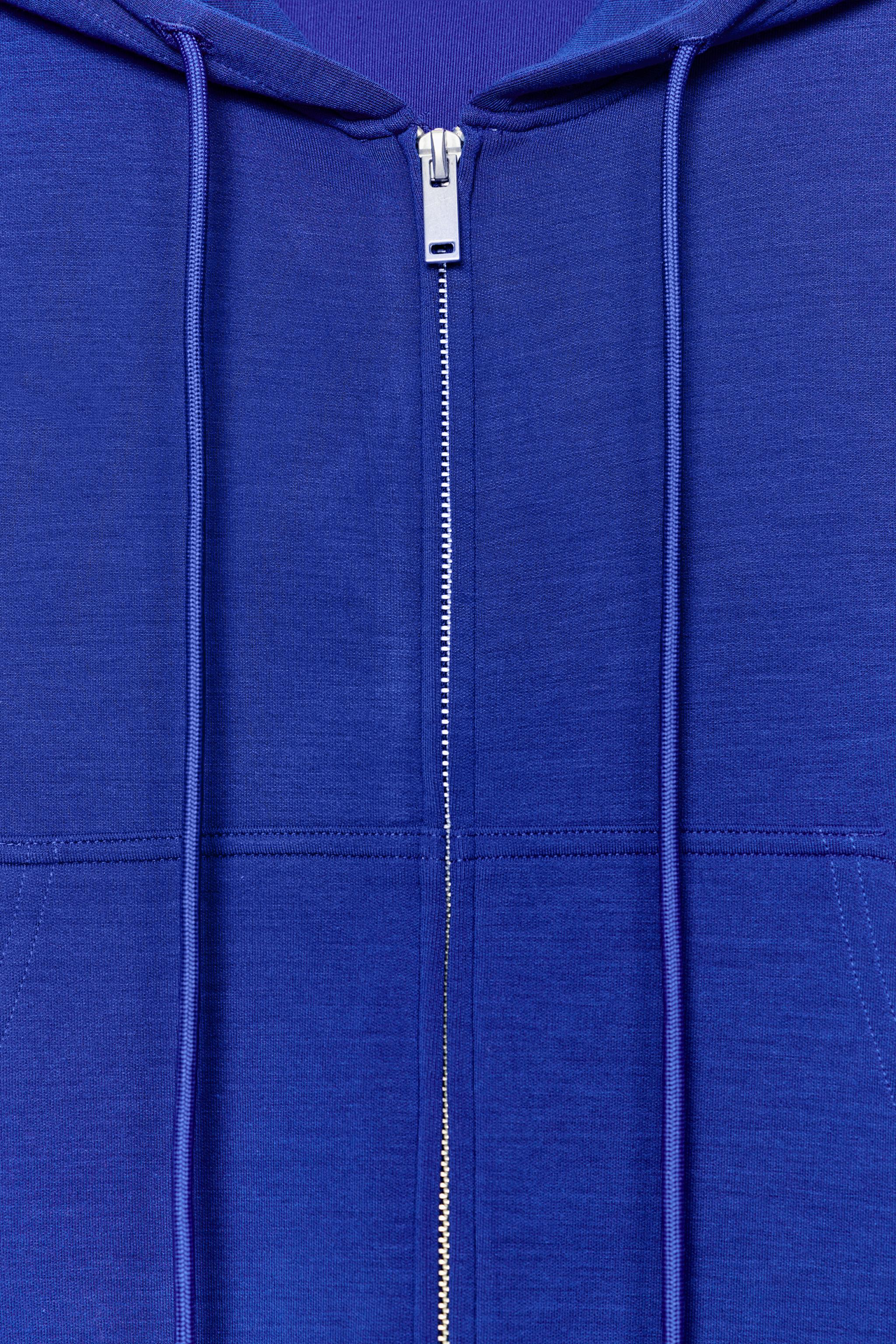 SWEAT INTERLOCK À CAPUCHE